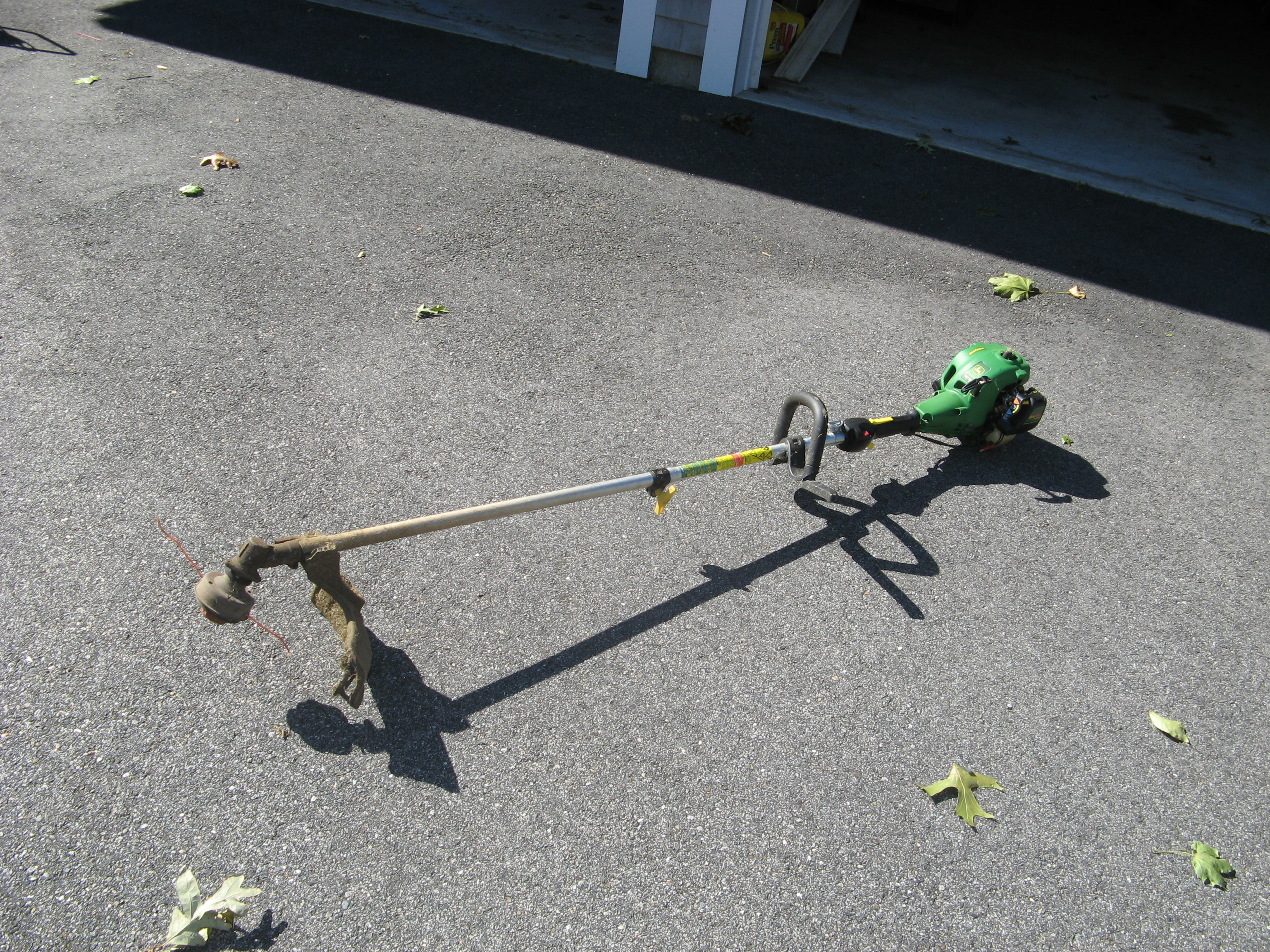 What's the benefit of using a John Deere line trimmer?